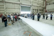 NASA Social attendees gather for a presentation near the starboard wing of the Global Hawk UAV...on May 31, 2016.