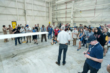 NASA Social attendees gather for a presentation near the starboard wing of the Global Hawk UAV...on May 31, 2016.