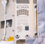 A commemorative plaque carrying a memory card that contains the names of over 1.3 million people is attached to the Roman Space Telescope