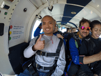 Posing for the camera as the aircraft reaches jumping altitude for my tandem skydive above Oceanside...on October 4, 2018.