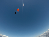 The videographer falls away from me and my tandem instructor after our main parachute deployed...on October 4, 2018.