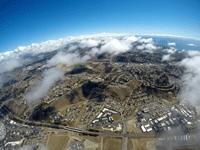 Another snapshot of Oceanside and the Pacific Ocean from my videographer's GoPro camera as she continues to free fall towards the landing zone...on October 4, 2018.