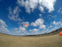 My videographer films me and my tandem instructor as we come in for a landing at the drop zone...on October 4, 2018.