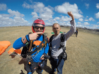 Posing with my tandem instructor after we touched down on the drop zone at Oceanside...on October 4, 2018.