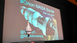 A close-up of the Orion EFT (Exploration Flight Test)-1 miniature model on stage.