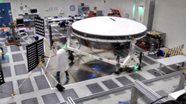 Engineers work on the Low-Density Supersonic Decelerator inside JPL's Spacecraft Assembly Facility...on December 3, 2014.