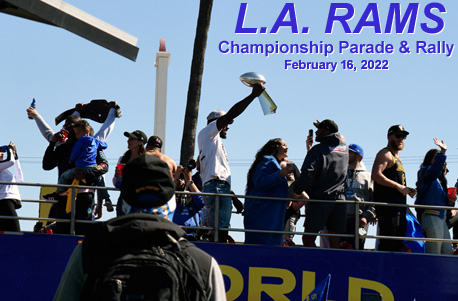 The Vince Lombardi Trophy is hoisted into the air by outside linebacker Leonard Floyd during the L.A. Rams' championship parade and rally on February 16, 2022.