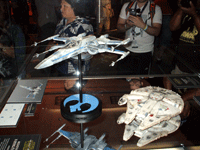 A Resistance X-Wing fighter and a Millennium Falcon model from THE FORCE AWAKENS on display at Star Wars Celebration on April 17, 2015.