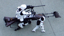 A young fan poses with a scout trooper and his speeder bike at Star Wars Celebration in Anaheim...on April 17, 2015.