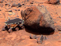 The Sojourner rover studies a Martian rock nicknamed 'Yogi'