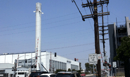 Another photo of the Falcon 9 as it towers above the main building at SpaceX Headquarters...on August 25, 2016.