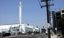 Another photo of the Falcon 9 as it towers above the main building at SpaceX Headquarters...on August 25, 2016.