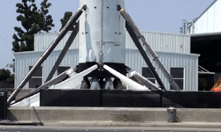 Another shot of the landing legs and the (replica?) Merlin 1D engines underneath the Falcon 9 booster...on August 25, 2016.