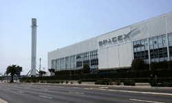 Another photo of the Falcon 9 as it towers above the main building at SpaceX Headquarters...on August 25, 2016.