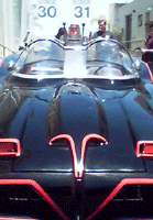 A frontal view of the Batmobile with Stages 30 and 31 in the background