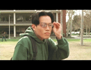 Walking to a different part of campus, Rick uses his broken eyeglasses to check out Julie (off-screen).