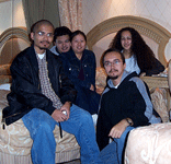 Taking a group photo inside our hotel room at Treasure Island.
