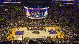 Pau Gasol and his family pose with a framed copy of his jersey during the halftime ceremony at Crypto.com Arena...on March 7, 2023.